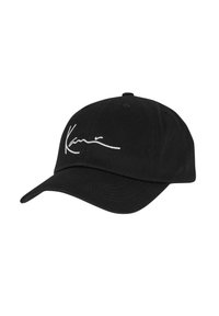 Casquette de baseball noire en coton avec une visière incurvée et une signature blanche brodée à l'avant. Dispose d'œillets de ventilation sur le dessus.