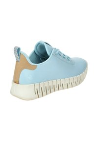Light blue sneaker with a smooth upper, light tan accents, textured inner lining, and a thick white sole with cut-out patterns.