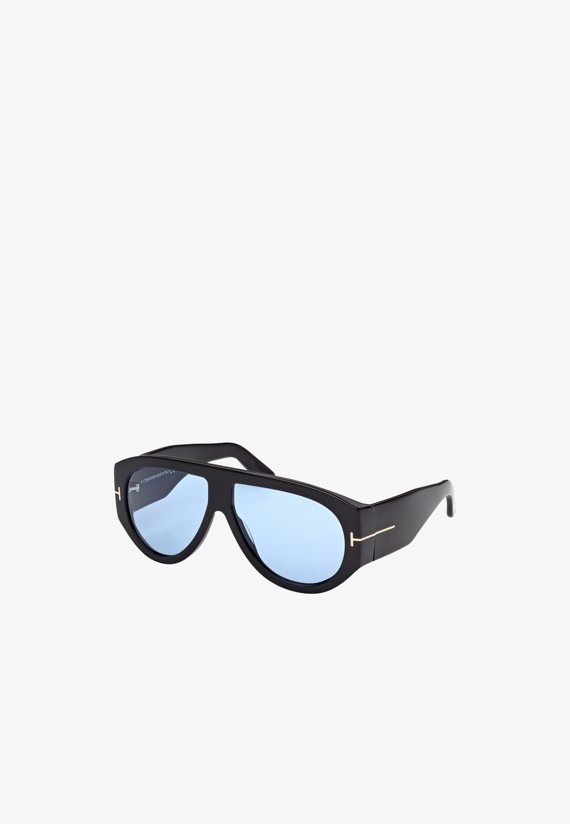 Mustat aurinkolasit, joissa on tyylikäs kissojen silmä -muotoilu ja siniset linssit. Huomattavat kultaiset yksityiskohdat temppeleissä lisäävät modernia ilmettä.