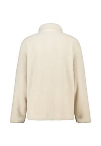 Cream-colored fleece pullover with a soft, textured surface, a mock collar, and long sleeves, featuring a boxy, relaxed fit.