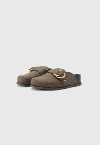 Brown patterned clogs with a gold buckle detail, flat black soles, and a textured fabric upper. Open back for slip-on convenience.