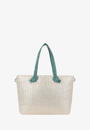 Sac fourre-tout beige tissé avec de larges poignées en tissu bleu sarcelle fixées par des nœuds, forme rectangulaire et anneaux métalliques sur les côtés.