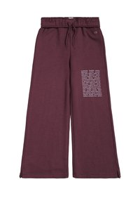 Pantalones de chándal anchos en color burdeos con cinturilla elástica, cordón ajustable y texto impreso en la pierna izquierda. Fabricados con un tejido suave y texturizado.