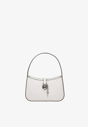 White Michael Kors handbag with shoulder strap, logo pattern, and circular MK charm hanging from front clasp.