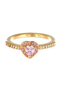 Bague en or ornée d'une pierre rose en forme de cœur entourée de plus petites cristaux roses et transparents, montée sur un anneau lisse marqué "925 Ag."