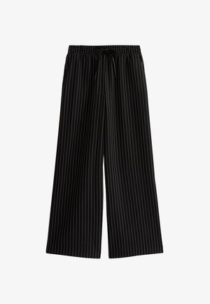 Pantaloni neri a gamba larga con strisce verticali bianche, dotati di una vita elastica e cordino. Tessuto liscio, design casual.