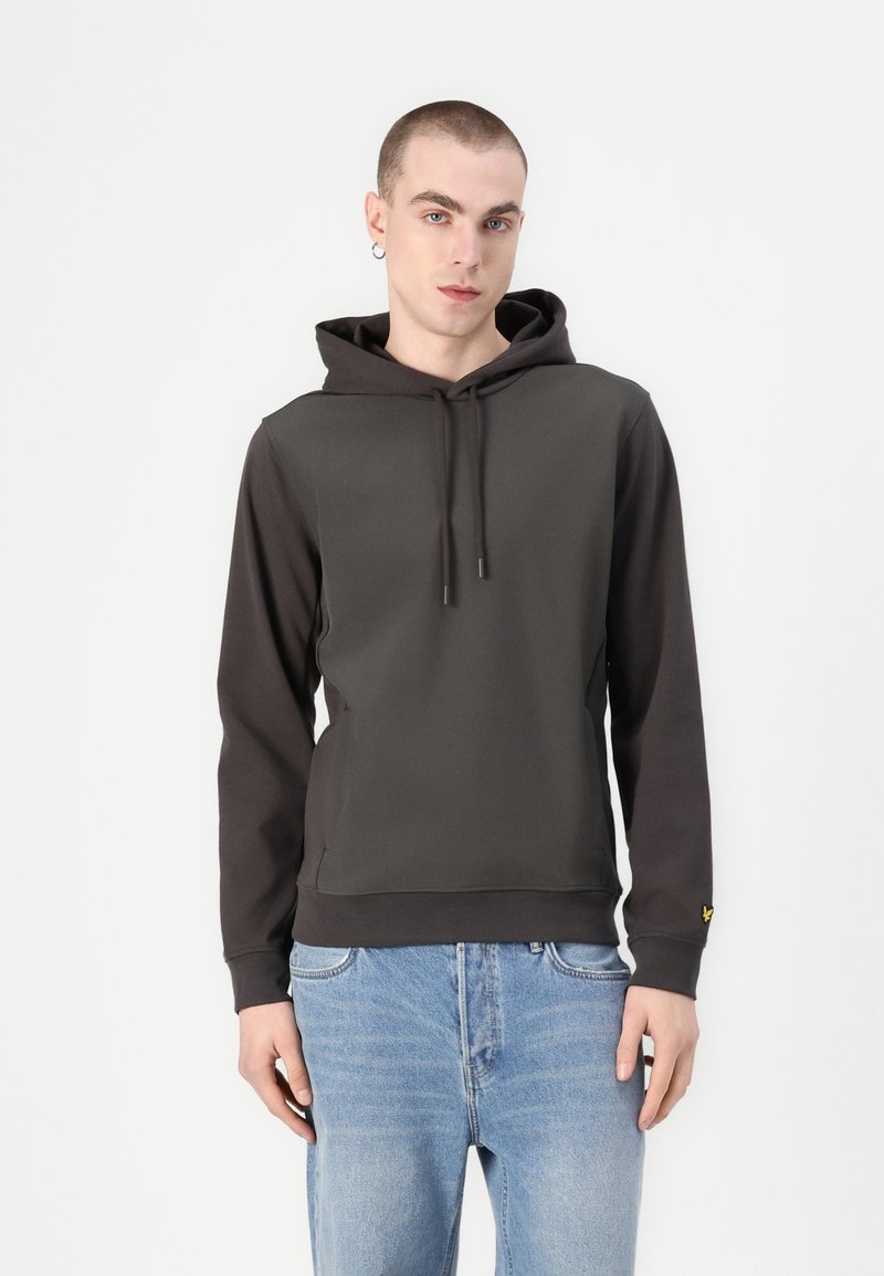 Dark gray hoodie with a drawstring, front pockets, and contrasting lighter gray accents. Worn with light blue denim jeans.