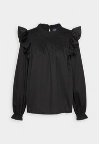 Blusa nera a maniche lunghe con spalline arricciate, corpetto arricciato e polsini elasticizzati. Realizzata in un tessuto morbido. Design con collo alto.