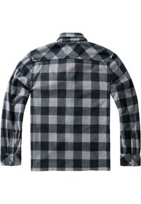 Chemise en flanelle à carreaux noirs et gris à manches longues, vue de dos avec poignets boutonnés et col plié.