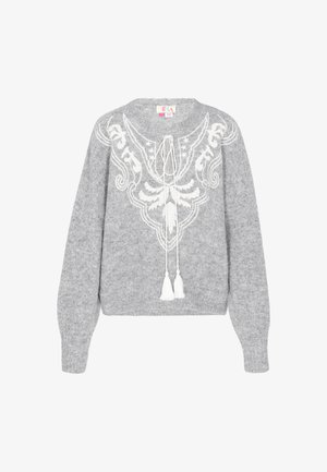 Hallitusest lõngast kampsun valge dekoratiivse mustriga, ümara kaelusega ja paelaga, millel on pallas. Pehme tekstuur ja vabalt langev lõige.