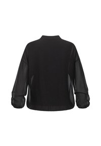 Blusa nera, maniche lunghe trasparenti, vestibilità comoda, colletto, tessuto morbido, vista posteriore, senza chiusure o fantasie visibili.