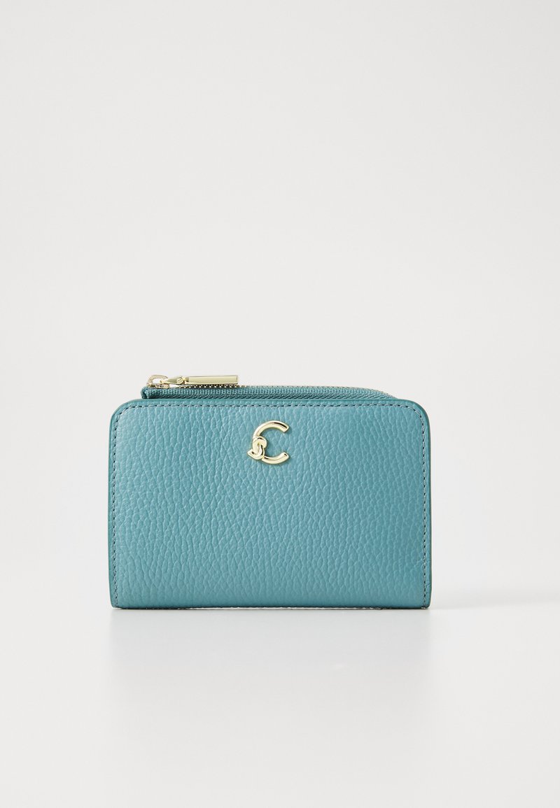 Teal leather wallet with a textured finish, featuring a gold logo accent and a zippered closure at the top. Compact rectangular design.