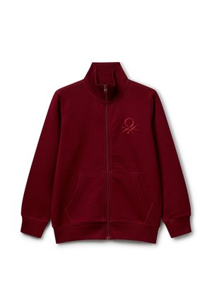 Giacca a zip color mogano realizzata in misto cotone con colletto alto, tasche frontali e logo ricamato sul petto. Texture liscia.