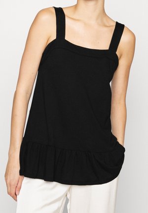 Sort ærmeløs top med brede stropper, flæsekant, letvægts bomuldsmateriale og afslappet pasform. Inkluderer sidelommer.