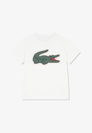 White cotton t-shirt featuring a green crocodile graphic with red accents and beige outline. Regular fit with short sleeves.