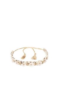 Diadema de cuentas con una base de tela de color beige claro, adornada con acentos perlados, embellishments florales y ataduras de borlas.