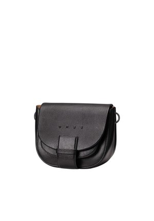 Black leather small crossbody bag with curved flap and magnetic strap closure, featuring subtle branded text on the front.