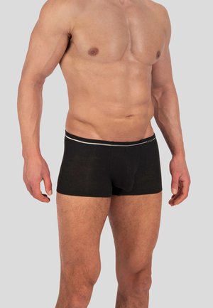 Boxer-bras noirs en tissu côtelé avec un design ajusté et une taille argentée contrastante. Aucune motif ou logo visible.