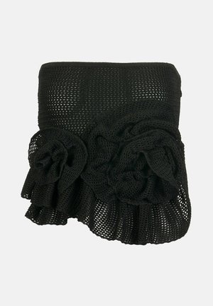 Czarny, bezramkowy top z siateczkowej tkaniny z dwoma dużymi rozetami z tkaniny i falbaną u dołu.