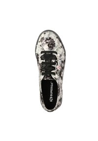 Black and white floral canvas sneaker with black laces, round toe, and rubber sole. Features branding on the tongue and insole.