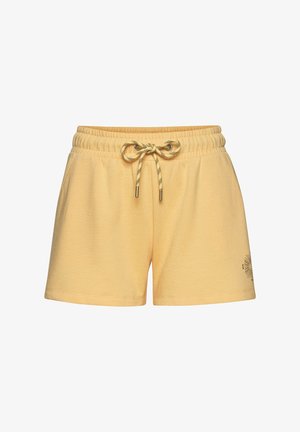 Yellow cotton shorts with a drawstring waist, featuring a textured finish and a small graphic design on the lower side.