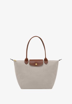 Gray tote bag with brown leather accents, featuring dual handles, a zip closure, and a pocket with a distinctive metal snap.