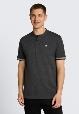 Man smiling wearing a dark gray short-sleeve henley shirt with three buttons and light trim on sleeve edges, standing against light background.