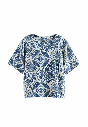 Short-sleeve shirt in beige with intricate blue floral and geometric patterns. Features a crew neck and relaxed fit.