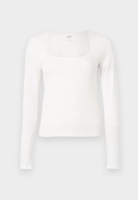 Biely top s dlhým rukávom a štvorcovým výstrihom, vyrobený z jemného bavlneného materiálu. Hladká textúra, priliehavý strih a minimálne označenie na krku.