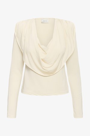 Cream-colored long-sleeve blouse with draped cowl neckline and subtle shoulder gathers, labeled "GESTUZ" inside collar.
