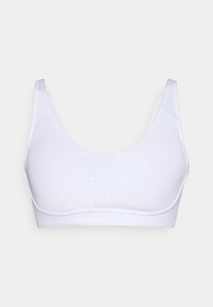 White sports bra with a smooth, stretchy fabric, featuring a mesh panel for breathability and a subtle logo at the bottom.