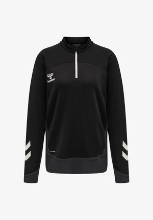 Sort sportstop med lange ærmer med hvid kvart lynlås, hvidt logo på brystet, chevronmønstre på ærmerne og tekstureret nederste kant og manchetter.