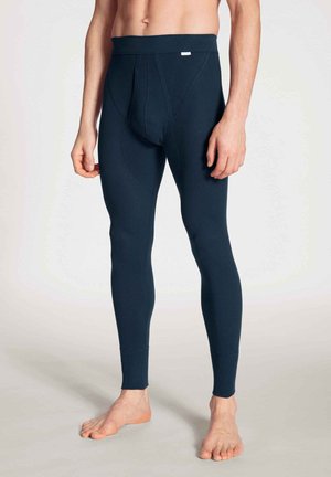 Leggings bleu marine au design slim, fabriqués dans un tissu lisse et extensible. Dotés d'une large taille et de coutures renforcées.