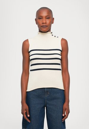 Top a collo alto senza maniche di colore crema con righe orizzontali blu navy e tre bottoni decorativi sulla spalla sinistra.