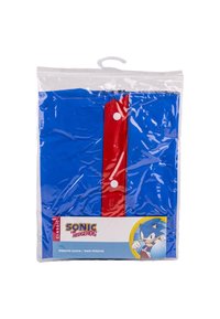 Poncho de pluie bleu avec fermeture rouge et boutons blancs, emballé dans un plastique transparent. Présente la marque Sonic the Hedgehog sur l'étiquette.