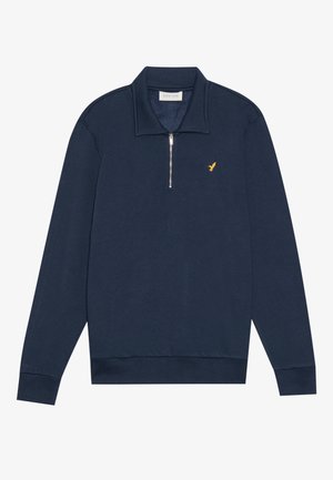 Navy pullover sweatshirt with a half-zip collar. Features a small yellow logo on the chest and ribbed cuffs and hem. Soft texture.
