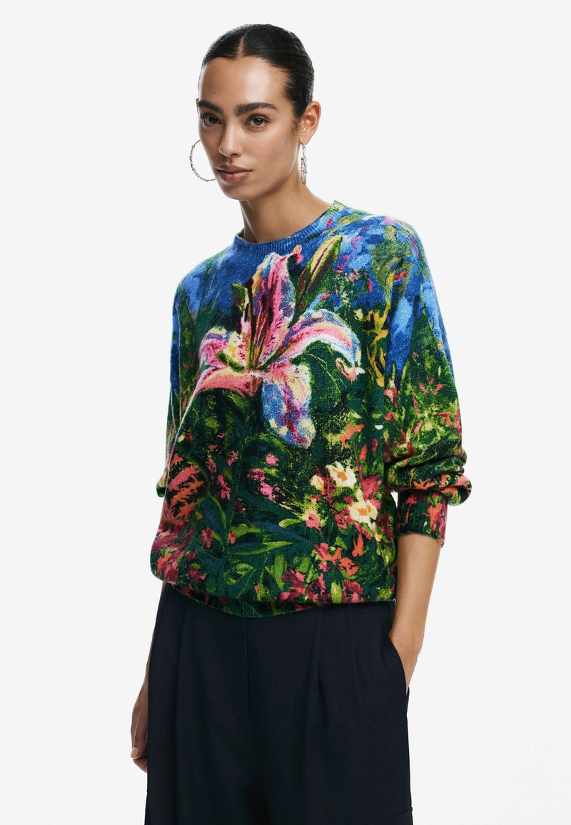 Maglione a motivi floreali in vivaci tonalità di blu, verde e rosa. Tessuto morbido, design a pullover con collo rotondo e vestibilità comoda.