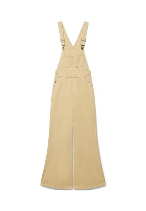 Tuta beige a gambe larghe con spalline regolabili, tasca frontale al petto e chiusure laterali con bottoni su sfondo bianco semplice.
