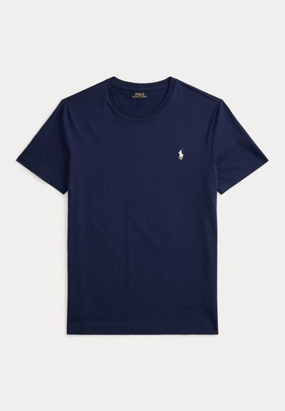 Σκούρο μπλε βαμβακερό T-shirt με κοντά μανίκια και στρογγυλή λαιμόκοψη. Διαθέτει μικρό λευκό κεντημένο λογότυπο στο στήθος.