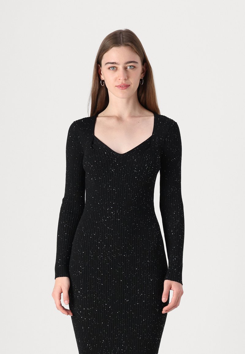 Black long-sleeve dress featuring a fitted ribbed design with a V-neckline, adorned with scattered glitter details throughout.
