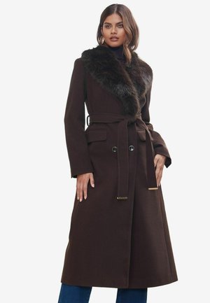 Brown wool coat featuring a faux fur collar, belted waist, side pockets, and gold-tone hardware accents. Smooth texture and mid-length cut.