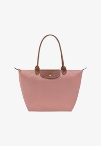 Unselected, rosa tee