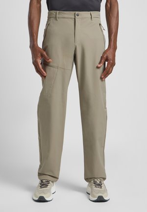 Beige hiking pants with a straight leg design, featuring side pockets, reinforced stitching, and a button closure at the waistband.