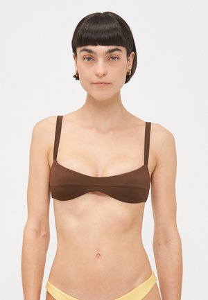 Brown bikini top with a smooth texture, structured design, and thin adjustable straps. Features a wide band and low-cut neckline.