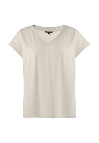 Jasno beżowa koszulka z dekoltem w kształcie litery V, krótkie rękawy, gładki materiał, luźny krój, boczne rozcięcia, minimalistyczny design bez widocznych wzorów czy akcentów.