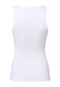 Top senza maniche bianco a coste con scollatura rotonda e silhouette aderente, realizzato in morbido cotone.