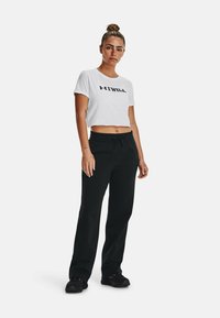 Under Armour RIVAL - Spodnji deli trenirk - black