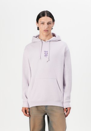 Light purple hooded sweatshirt with drawstrings, front kangaroo pocket, and a small printed logo on the chest. Soft fabric texture.
