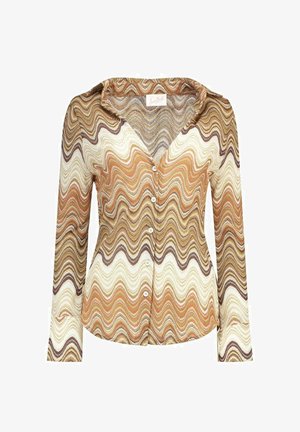 Blouse femme manches longues boutonnée avec col pointu en motif zigzag ondulé dans des tons marron, beige, crème et orange.