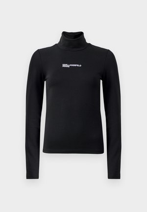 Melnā garām piedurknēm turtlenecka virsma, izgatavota no elastīga materiāla. Uz krūšu ir balts logo teksts "KARL LAGERFELD JEANS". Gluda tekstūra.